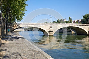 Paris, empty Seine river docks and bridge in a sunny day in France