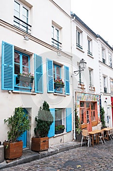 Paris, France, 11.22.2018 Montmartre, View of the traditional old French house facade in Paris with two windows.
