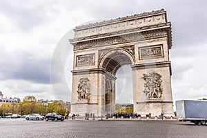 Paris, France - APRIL 9, 2019: Champs-Elysees and Arc de Triomphe on a cloudy day, Paris