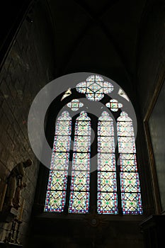 Paris, France - April 1, 2019: Stained glass window inside the Notre Dame Cathedral, Paris, France