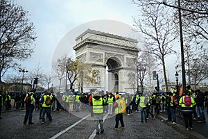 Yellow vests - Gilets jaunes protests - Protester in front of Arc de Triomphe on Champs Elysees