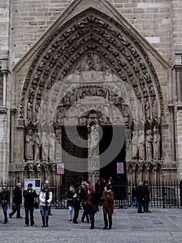Paris, France February 22, 2013: Fragment of the front elevation with the entrance to the Notre Dame cathedral in Paris