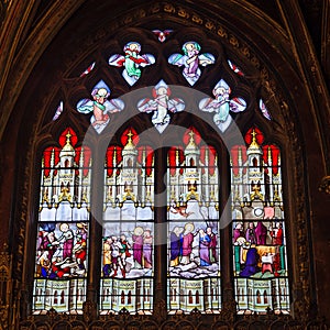 Beautiful stained glass window inside Notre Dame de Paris.