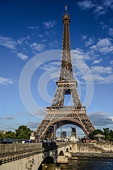 Paris, France, July 1, 2022. The Eiffel Tower seen from the opposite bank of the Seine. The warm light of late afternoon