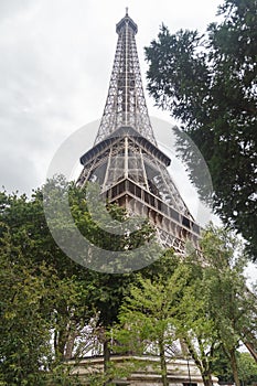 Paris, France - July 13 2019: The Eiffel Tower in overcast. Bottom view