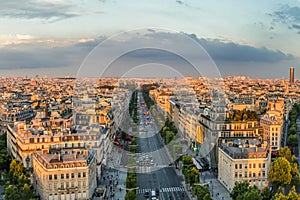 Paris, France - June 24, 2016: The Champs-Elysees sunset view from the top of Triumphal Arch de l Etoile the most famous avenue of