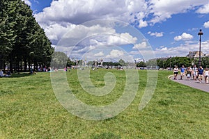 Paris, France - June 25, 2016: Beautiful green Park bitween Les Invalides and Alexandre III Bridge. Les Invalides is a complex of photo