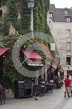 Paris, France - June 25, 2022: Cafe with a terrace in Paris.