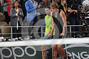 Injured tennis player Alexander Zverev of Germany enters court on crutches after his semi-final match against Rafael Nadal