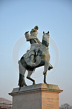 Paris, France 03.26.2017: Louis XIV statue in front of Versailles Palace