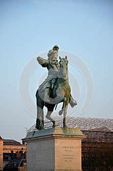 Paris, France 03.26.2017: Louis XIV statue in front of Versailles Palace.