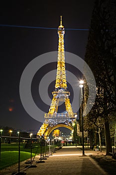 Paris, France, March 27 2017: Eiffel Tower in Paris at night with lights on