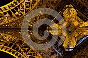 Paris, France, March 27 2017: Eiffel Tower in Paris at night with lights on