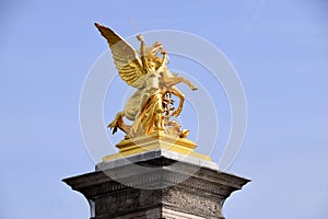 Golden Statue on the end of Pont Alexander III. Paris, France. March 29, 2023.