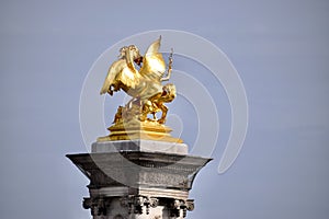 Golden Statue on the end of Pont Alexander III. Paris, France. March 29, 2023.