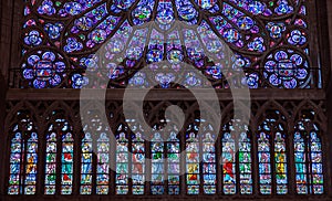 Paris, France, March 27, 2017: Stained glass window at Notre Dame cathedral. Notre Dame church is one of the top tourist