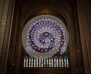 Paris, France, March 27, 2017: Stained glass window at Notre Dame cathedral. Notre Dame church is one of the top tourist