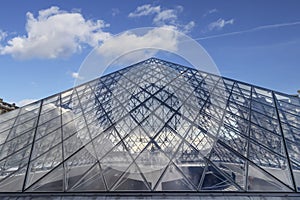 Paris, France - March 13, 2018: View of pyramid of Louvre museum from inside at night