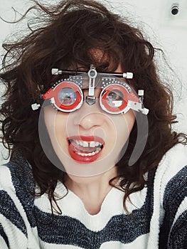 PARIS, FRANCE - MAY 04, 2023: funny girl in glasses for checking eyesight