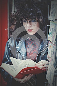 PARIS, FRANCE - MAY 04, 2023: girl in secondhand bookstore in Paris