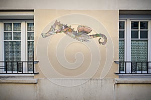 Detail of a seahorse painted on an apartment building, Butte-aux