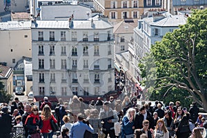 PARIS, FRANCE - MAY 1 2016 - Montmartre stairway crowded of people for sunday sunny day