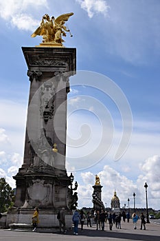 Paris, France - May 1, 2018: The Pont Alexandre III bridge across the Seine River and Petit Palais on the riverside, in front of