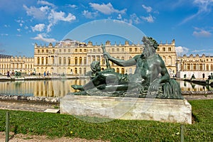Paris, France - May 2019: Versailles palace and gardens with Neptune statue