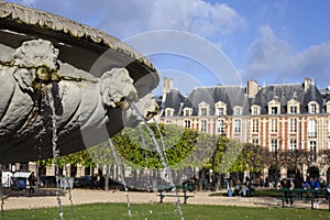 PARIS, FRANCE - November 19, 2023 : Place des Vosges is an ancient square in Paris.