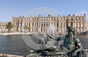 PARIS, FRANCE - OCTOBER, 15, 2017: close up of a bronze statue beside a chateau versailles fountain in paris