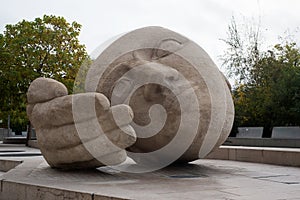 stoned statue in shaped head in les halles quarter