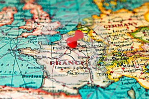 Paris, France pinned on vintage map of Europe