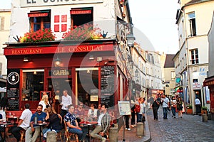 PARIS, FRANCE - 09 SEPTEMBER 2015: Cozy cafes and tourists on the street on Montmartre. Paris, France