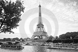 Paris, France - September 29, 2017: Seine river cruises and Eiffel tower. Boat rides. Waterside trips. Sightseeing tour