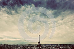 Paris, France skyline with Eiffel Tower. Dark clouds