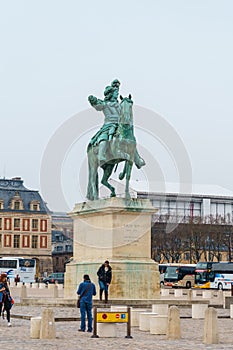 Paris, France - 19.01.2019: Statue of Louis XIV in front of the Versailles palace near Paris