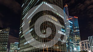 Paris, France - Timelapse - The Tall Buildings of La Defense Business District at Night Clouds Lights