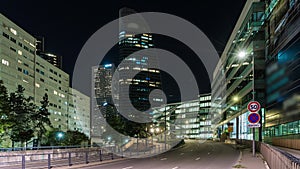 Paris, France - Timelapse - Traffic at Main Avenue in La Defense Business District at Night Buildings