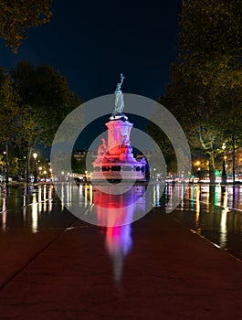 Paris by night the monument to the Republic with the symbolic statue of Marianna, in Place de la Republique photo