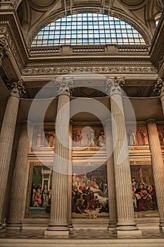 Pantheon inside view with high ceiling, columns, statues and paintings richly decorated in Paris.