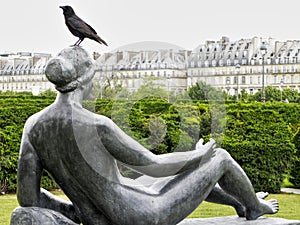 Paris park woman's sculpture with bird