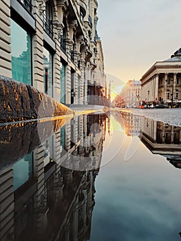 Paris street reflection and the haussmanian building view of the capital city of France