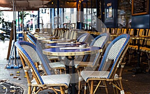 Paris. Street view of a Bistro with tables and chairs. Cafe parisian photo