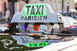 Paris taxi detail and Arc de Triomphe in the background