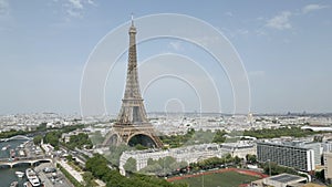 The Paris Tour Eiffel or Eiffel Tower with Pont Bir-Hakeim Bridge and Seine River in an aerial view