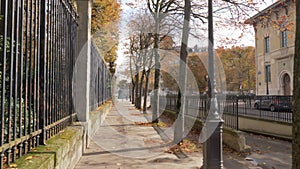 Paris view in autumn. Walking along the quiet street