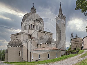 Parish Church of San Mamante and Delubro tower, Lizzano in Belvedere, Italy, under a dramatic sky photo