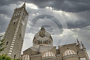 The Parish Church of San Mamante, Lizzano in Belvedere, Italy, under a dramatic sky photo