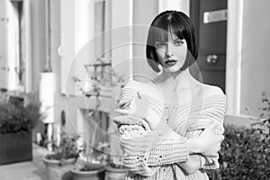 Parisian girl with stylish short brunette hair and red lips