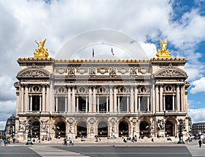 Parisians relaxing on the steps of the Opera Garnier house - Paris, France